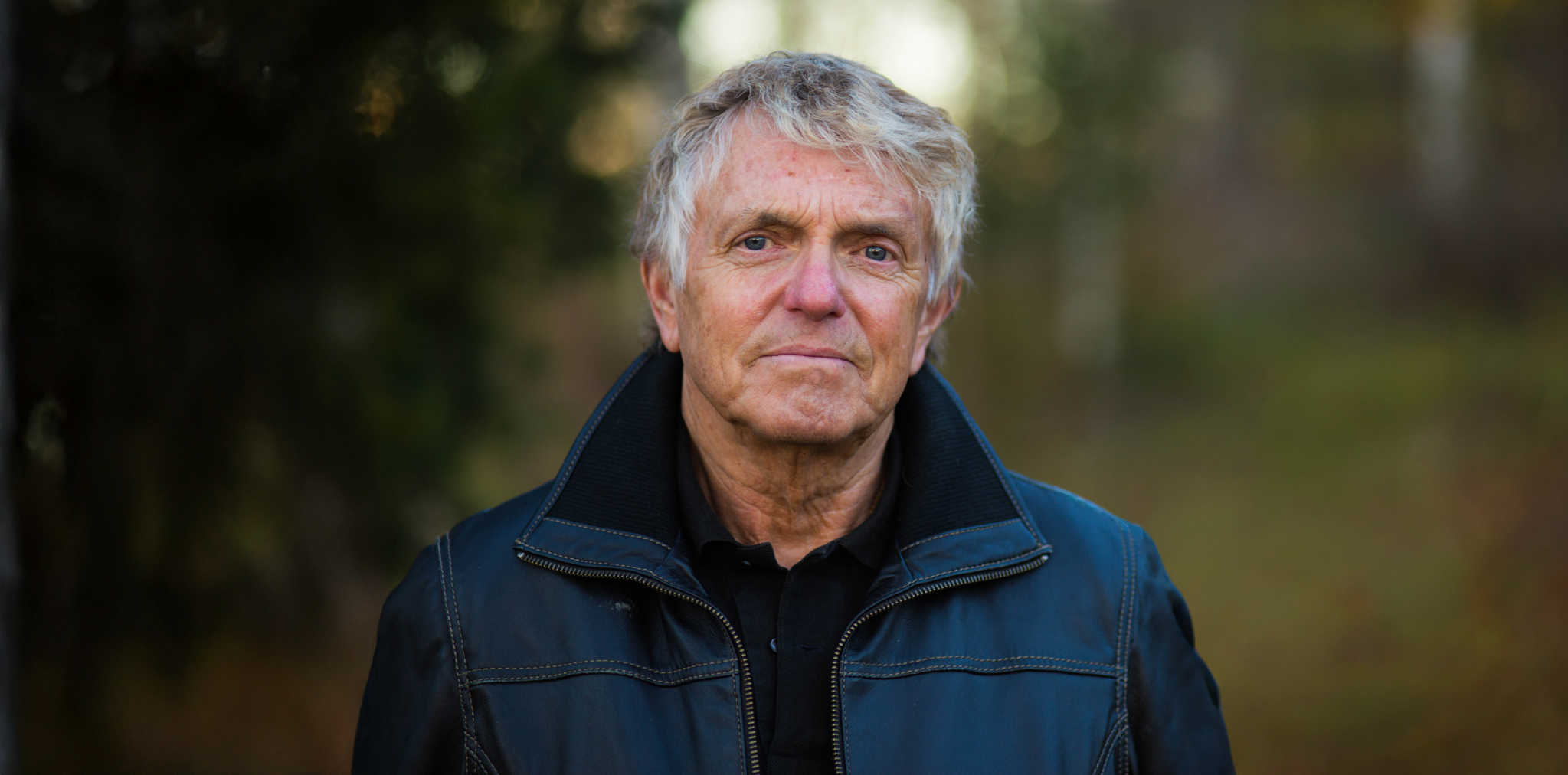 Portrait of a middle-aged Caucasian man in a leather jacket.